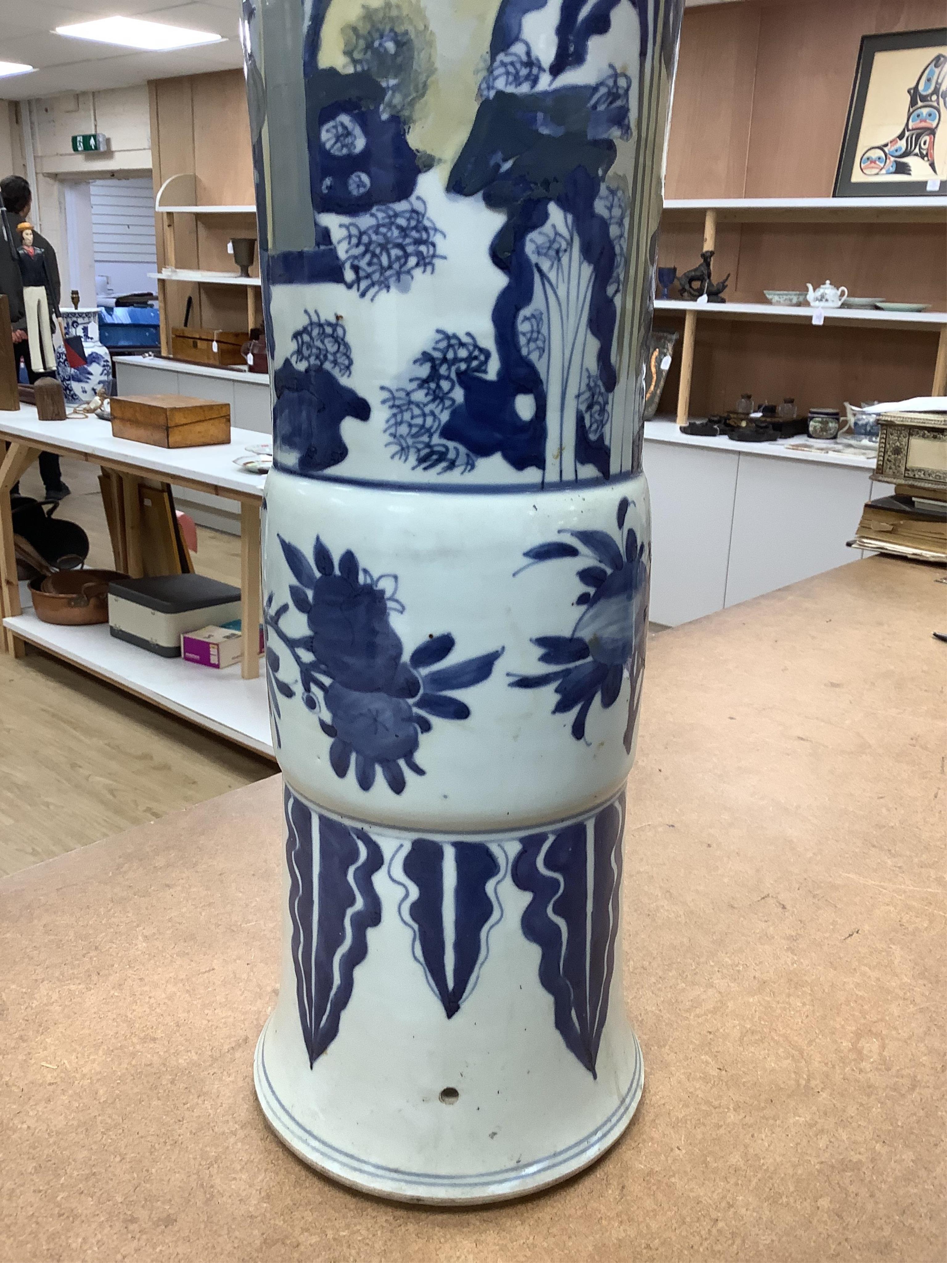 A Chinese blue and white sleeve vase. 53cm high. Condition - heavily restored.